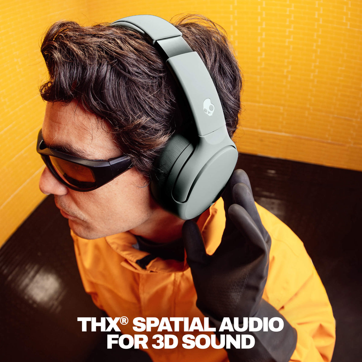 Cement | Person wearing Crusher 720 headphones with 'THX Spatial Audio For 3D Sound' text on a yellow background