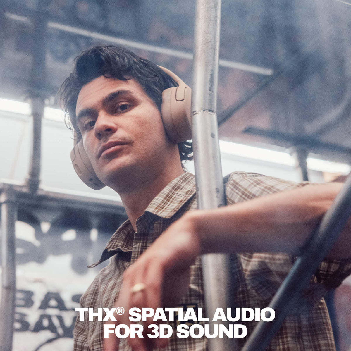 Primer | Person wearing Crusher 720 headphones with 'THX Spatial Audio FOR 3D Sound' branding in a blurred urban setting